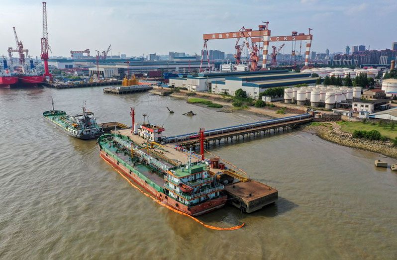 Oil tankers are seen at a terminal of Sinopec Yaogang oil depot in Nantong, Jiangsu province, China June (REUTERS/Stringer)