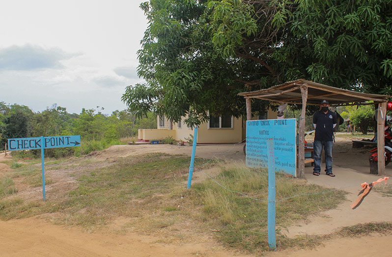 A gate and COVID-19 checkpoint constructed at the front of the community of Saurab, which is the gateway to the ‘Deep South’ (Vishani Ragobeer photo)