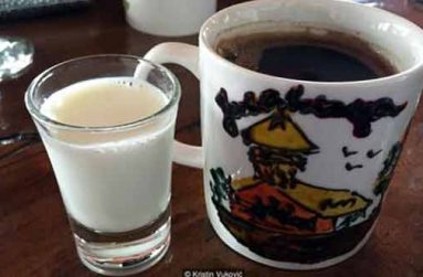 A glass of sweet donkey milk accompanies a cup of Turkish coffee (Credit: Kristin Vuković)