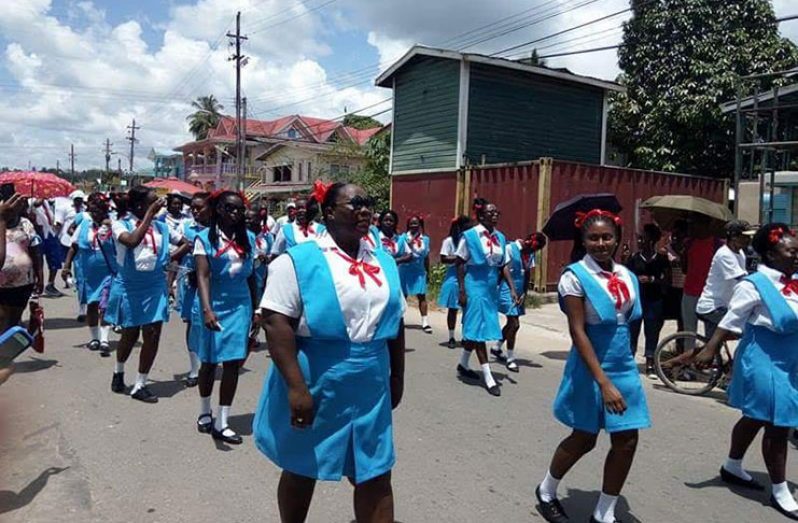 Teachers, dressed in school uniforms, during a march to observe Teacher’s Week