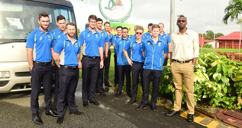 Sport Director Chris Jones (extreme right) greets the Australian Cricket team yesterday morning at the Cheddi Jagan International Airport (Adrian Narine photo)