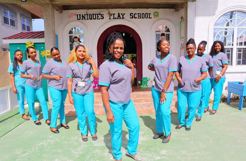 (Centre) Owner of Unique’s Play School, Day Care, and Nursery Programme, Taneka Latoya Sanchara flanked by her supportive team at work