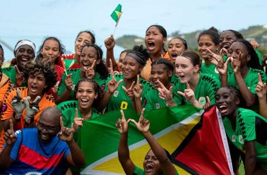 Guyana's Women U-20 team celebrating after beating Haiti