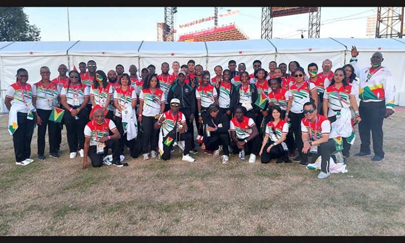 The 32 athletes, along with officials at the closing ceremony for the 2022 Commonwealth Games