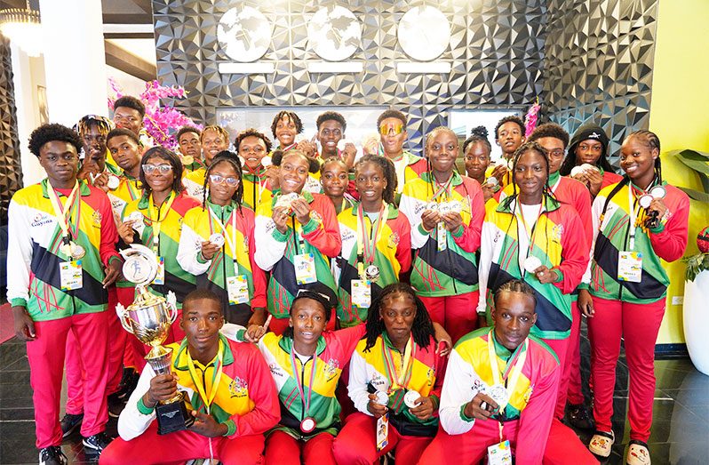 Team Guyana walked with the athletics Championship trophy (Calvin Chapman photo)