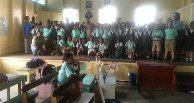 Commander of ‘F’ Division Ravindradat Budhram and team with students and teachers of St Anthony Primary School at an informative session on domestic violence and suicide