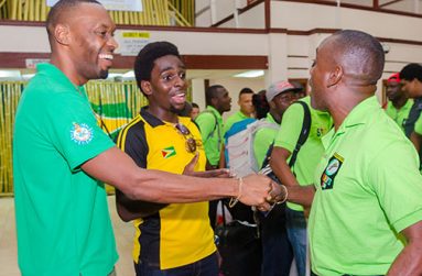 Director of Sport Chris Jones (left) shares a light moment with Green Machine Team manager Robbie Roberts (right) (Delano Williams Photo)