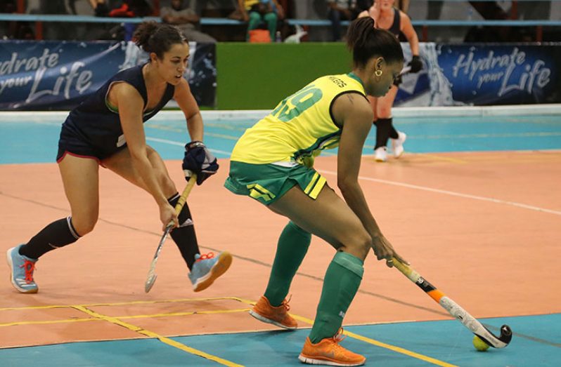 Flashback!  Hikers Krezia Layne being challenged by Leigh Sandison of the Toronto Toros during this year’s Diamond Mineral Water International Indoor Hockey Festival.
