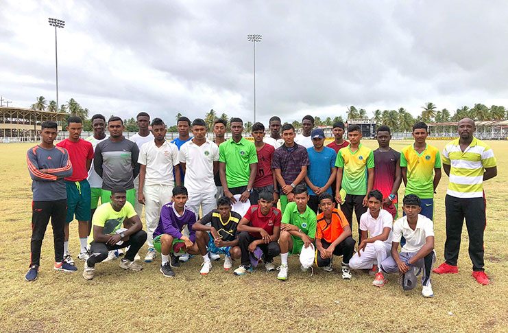 BCB under-17 squad poses with a few under 19s with assistant coach, Delbert Hicks after training (Colin Bynoe Photo)