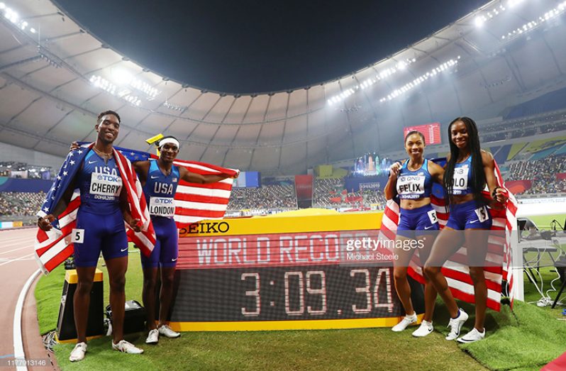 Wilbert London, Michael Cherry, Courtney Okolo and Allyson Felix of the United States pose after setting a new world record in the 4x400 Metres Mixed Relay during day three of 17th IAAF World Athletics Championships Doha 2019 at Khalifa International Stadium on September 29, 2019 in Doha, Qatar. (Photo by Michael Steele/Getty Images)