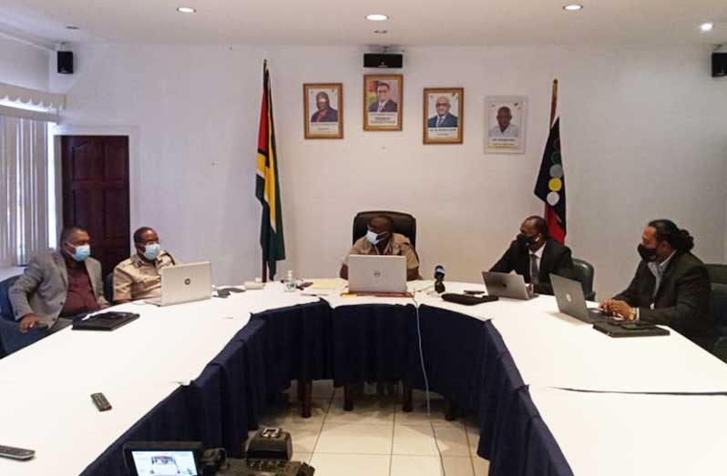 Commissioner of Police (ag), Nigel Hoppie (centre); Crime Chief, Wendell Blanhum (second from right); Deputy Commissioner of Police, Clifton Hicken (second from left), and Head of the GPF’s Corporate Communications Unit (CCU), Mark Ramotar (first from right), along with other police officials who were part of a virtual press briefing on Wednesday