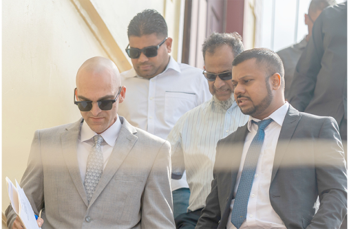Nazar and Azruddin Mohamed pictured with their attorneys, Siand Dhurjon and Damien Da Silva (Delano Williams photo)