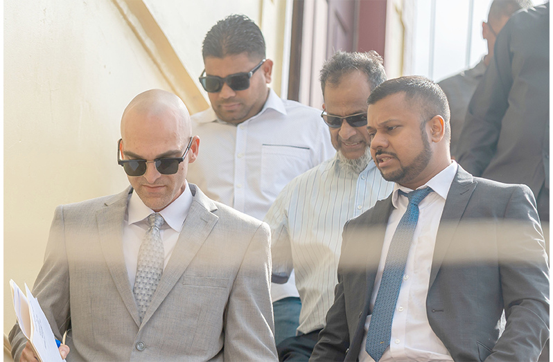 Nazar and Azruddin Mohamed pictured with their attorneys, Siand Dhurjon and Damien Da Silva (Delano Williams photo)