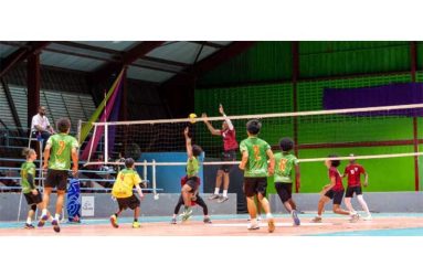 Guyana’s male Volleyball team in (red) battling French
Guiana in Green