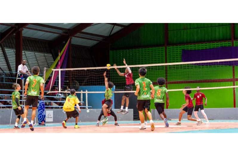 Guyana’s male Volleyball team in (red) battling French
Guiana in Green