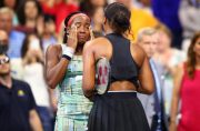 US teen Coco Gauff, left, wipes away tears as she speaks with top-ranked defending champion Naomi Osaka after the Japanese star advanced to the fourth round of the US Open on Saturday (AFP Photo/CLIVE BRUNSKILL)