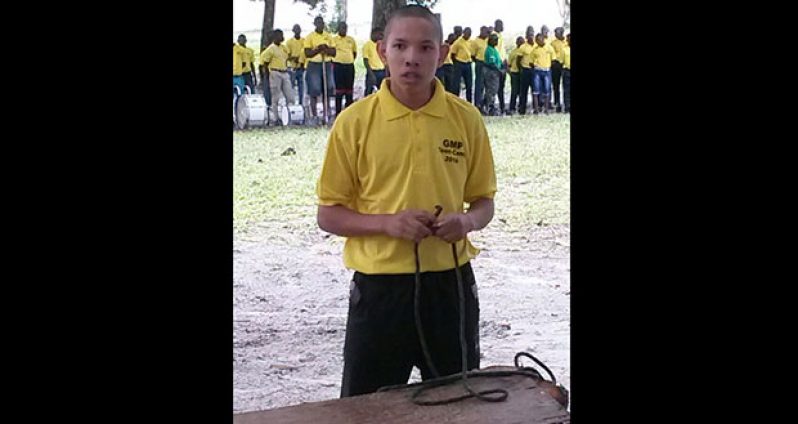 A member of the teen camp practises how to do rope knots