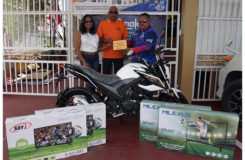 From left: Regal’s Telisha Ousman-Yamin, Mahendra ‘Anil’ Hardyal and John Ramsingh of FL Sport