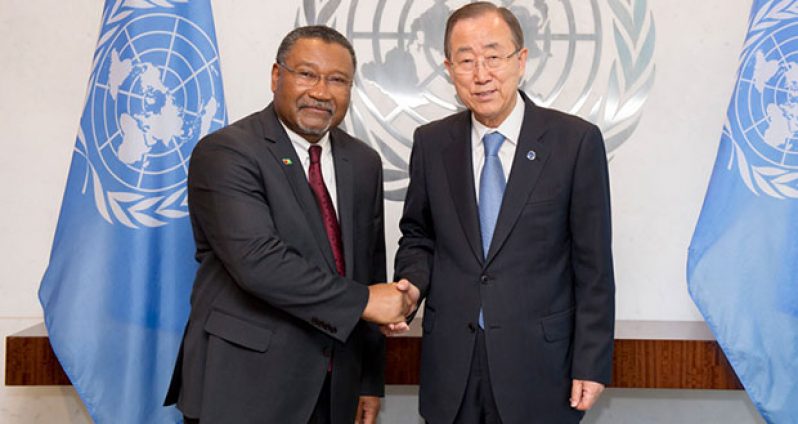 Ambassador Michael Ten-Pow (left) is seen with United Nations Secretary-General Ban Ki-moon
