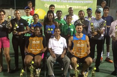 Winners and runner-ups at the just concluded GBTI Independence Jubilee Open tennis tournament. In the front row  from left are Afrucia Gentle, John Tracey and Anthony Downes.