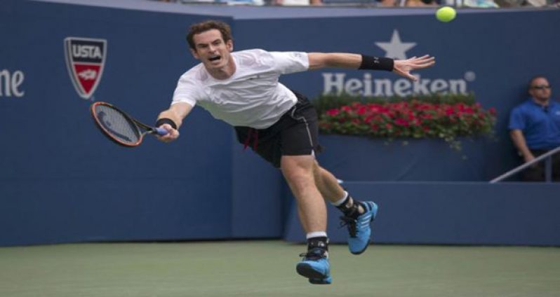 Andy Murray of Britain reaches to return a shot to Adrian Mannarino of France during their second round match, at the U.S. Open Championships tennis tournament in New York.