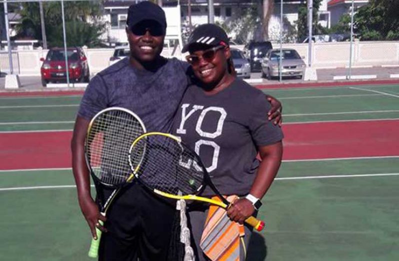 Tennis novice Delon Fraser, Liaison to the Crime Chief (left) and U.S. Peace Corps Country Director Kury Cobham after a match.