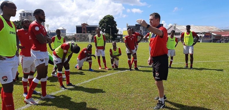 Soca Warriors  senior team men’s head coach Terry Fenwick gives instructions to his players as the team resumed training last month at the the St James Barracks. (Courtesy TTFA)