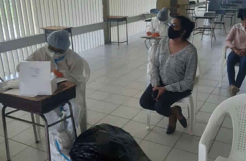 The COVID-19 team conducts testing at the Anna Regina (Multilateral) Secondary school