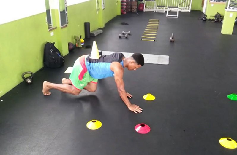 West Indies U-19 Wicketkeeper/Batsman Tevin Imlach performing a multiplanar Bear Crawl (Photo: Compliments of TopEnd Performance Training Systems)