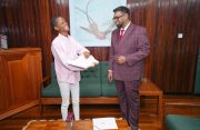 President Dr. Irfaan Ali after presenting Dr. Wright with a framed copy of her Guyanese birth certificate, and a copy of her parents’ marriage certificate