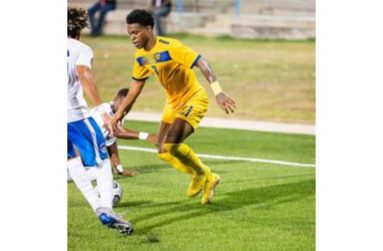 Thierry Gale of Barbados (right) opened the scoring against Saint Lucia.