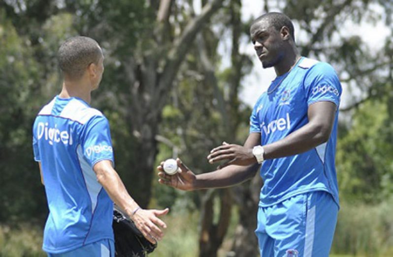 New West Indies bowling coach Alfonso Thomas chats with fast-bowling all-rounder Carlos Brathwaite during a training session. (Photo, courtesy CWI Media)
