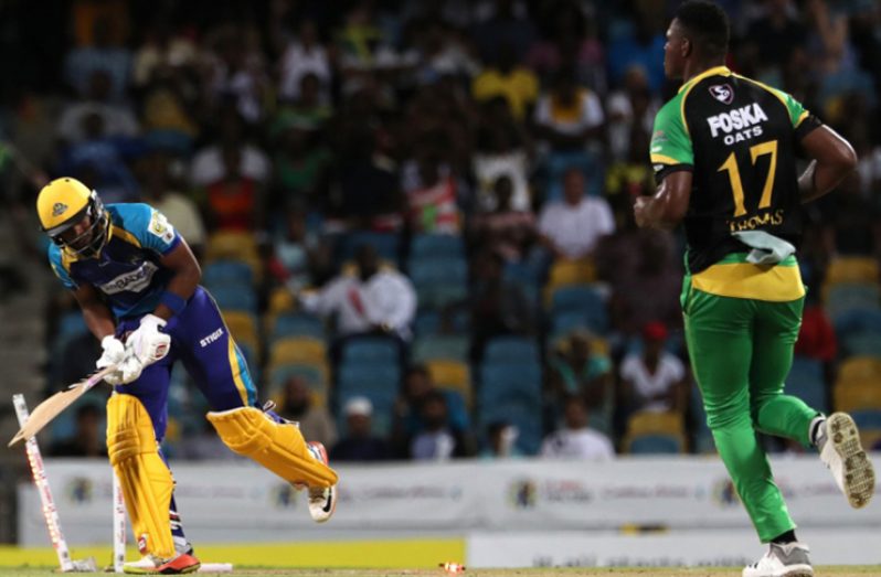Jamaica Tallawahs pace bowler Oshane Thomas looks on at the wreckage he created from a devastating yorker to Barbados Tridents batsman Shai Hope during the team's Hero Caribbean Premier League game at Kensington Oval on Wednesday night. (CPL photo)