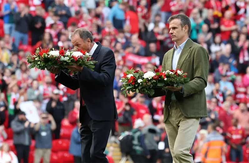 Liverpool legend Phil Thompson and Athletic President Jon Uriarte laid wreaths on the pitch before the first Anfield game since Jota's death