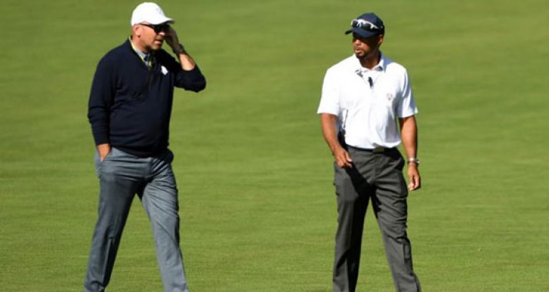 Team Europe vice-captain Thomas Bjorn and Team USA vice-captain Tiger Woods on the first hole during the single matches in 41st Ryder Cup Hazeltine National Golf Club. (Mandatory Credit: John David Mercer-USA TODAY Sports)
