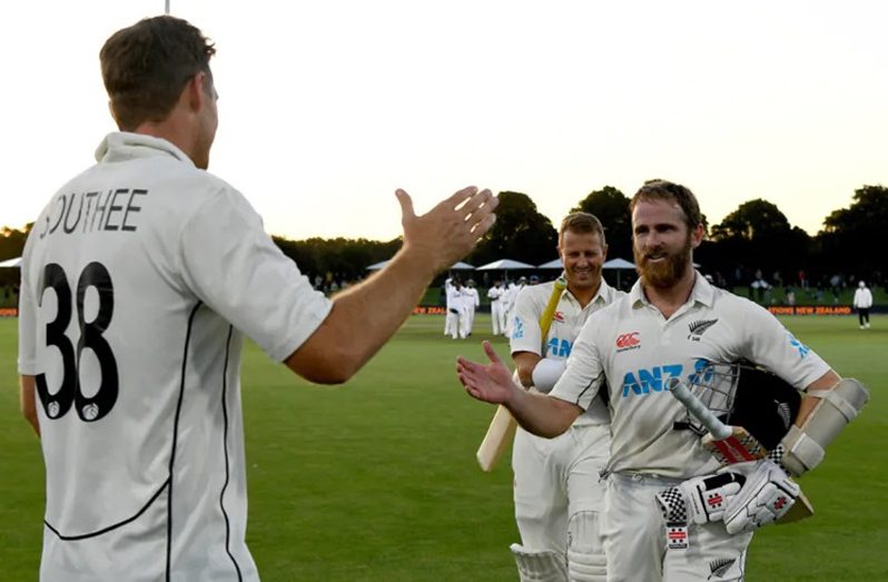 Captain Tim Southee greets his two match-winners, Kane Williamson and Neil Wagner  •  Getty Images