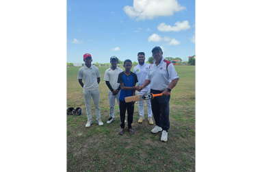 Timothy Ramsarack, left, collects bat from Hubern Evans