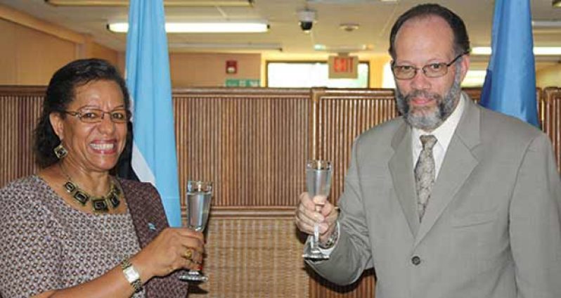Botswana’s Ambassador to CARICOM, Ms Bernadette Rathedi, shares a toast with CARICOM Secretary-General, Ambassador Irwin LaRocque, Thursday, after presenting her credentials to him at the CARICOM Secretariat