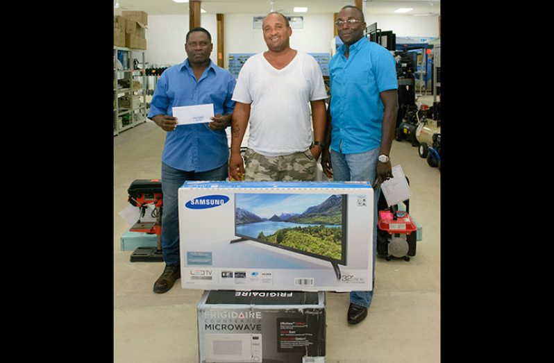 The top three winners with their prizes. From left are Leroy Lewis, Sean Clarke and Hubert Urlin