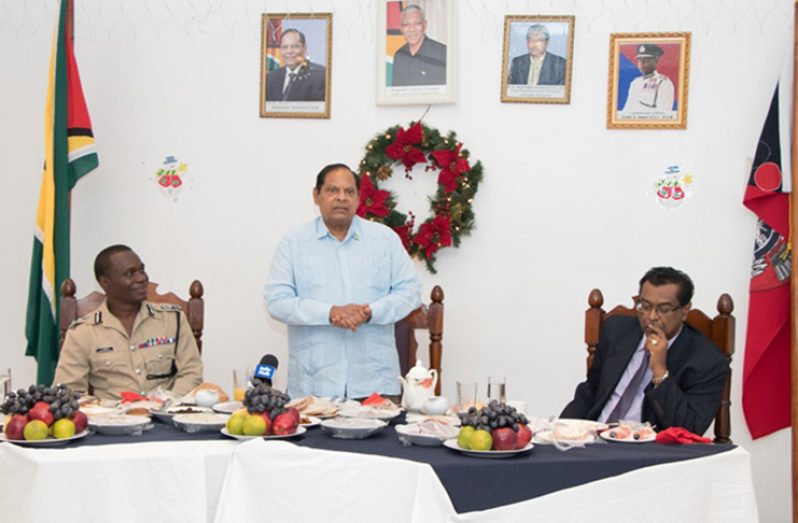 Prime Minister Moses Nagamootoo addressing the officers as Commissioner of Police Leslie James (left) and Minister of Public Security Khemraj Ramjattan (right)listen