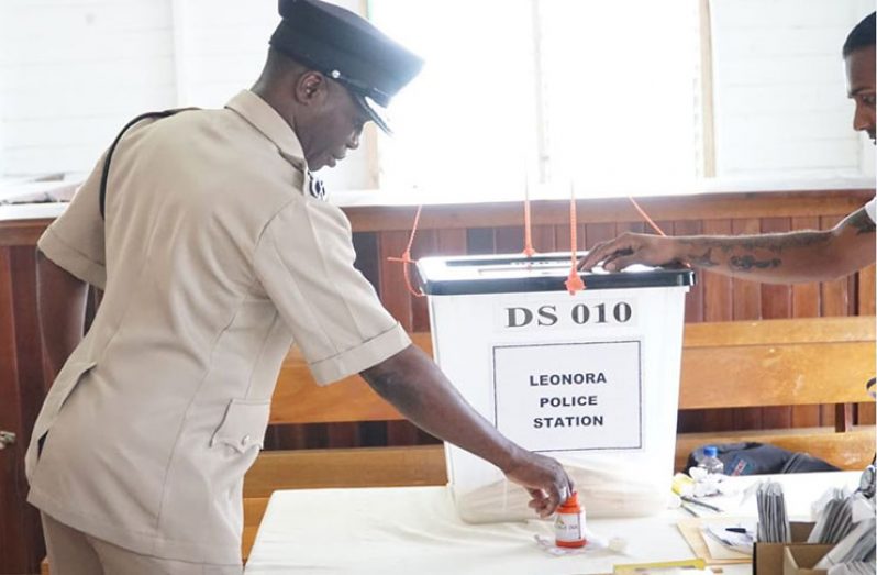 Commissioner of Police Leslie James casting  his vote at the Leonora Police Station Friday morning (Leroy Smith photo)