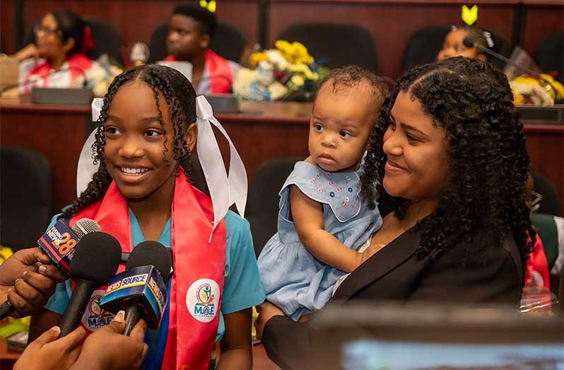 Top NGSA 2025 performer Tanasha Mayers, pictured here with her mother, Tiffany, made history with a perfect score, only the second ever to achieve this milestone (Delano Williams photo)