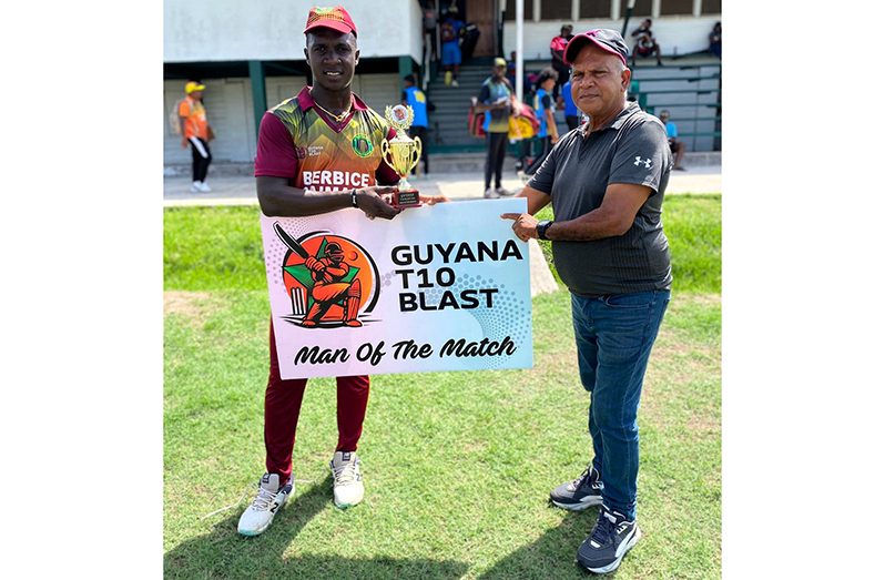 Kevlon Anderson collected his Man-of-the-match trophy from Umpire Totaram Ramnarine