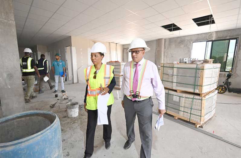 Minister of Housing and Water,  Collin Croal, and Minister within the Ministry,  Vanessa Benn, toured the project site