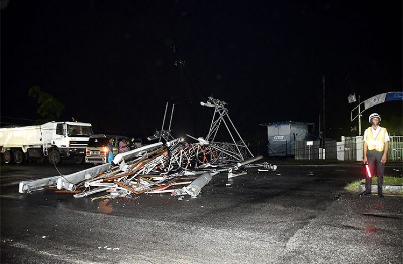 The destroyed tower laid across the road (Adrian Narine photo)