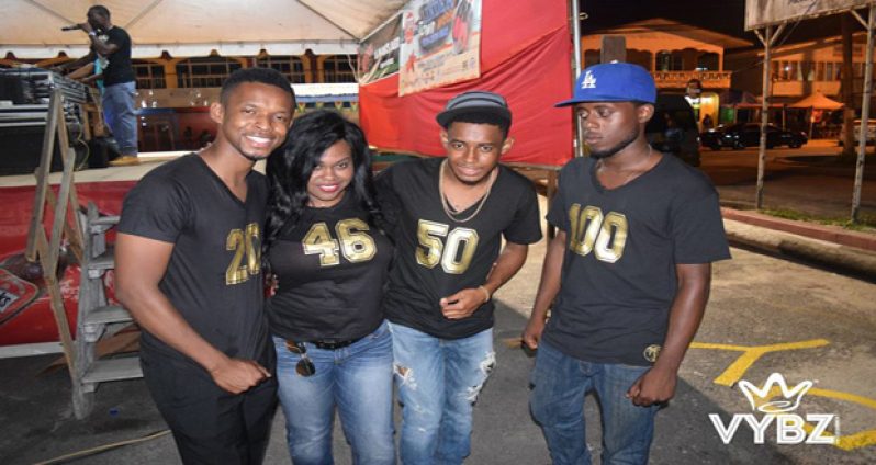 Vybz Entertainment Chairman Devin Sears (left) with other members of Vybz Entertainment T-Shirt Reference: 20 years of Linden Town Week, 46 years as a Town, 50 years Independent Nation, and 100 years Bauxite Mining 