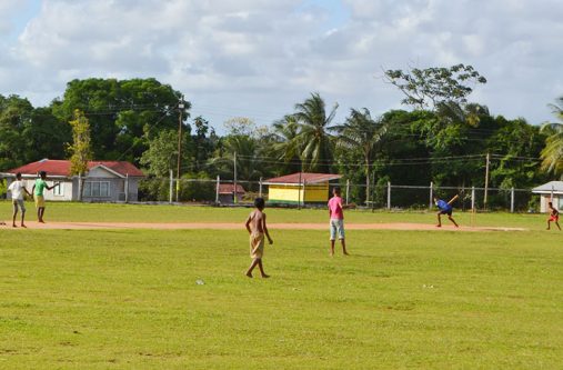 Children in the midst of a game of cricket at the Mabaruma Settlement Ground . The ground’s upkeep and maintenance falls under the ambit of the town council and several areas of improvement are expected to be undertaken there, including the construction of additional bleachers for spectators.