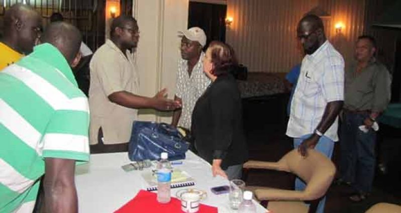 Presidential Advisor on Governance Ms. Gail Teixeira interacting with a Linden resident after wrapping up the town hall meeting on Wednesday last.