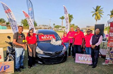 Officials of the GSCL and sponsors pose with the Toyota Vitz Car which will be won by the MVP of the Legends Over-50 category. From left are, Danny Persaud of ARD Youtuber, Tilesha Ousman, Secretary/Treasurer of the GSCL, Shurine Hardyal/Mahendra Hardyal of title sponsors, Regal Stationery & Computer Centre, GSCL President Ian John, Tournament Director John Ramsingh and Jitendra Singh of Rajiv Gandhi University