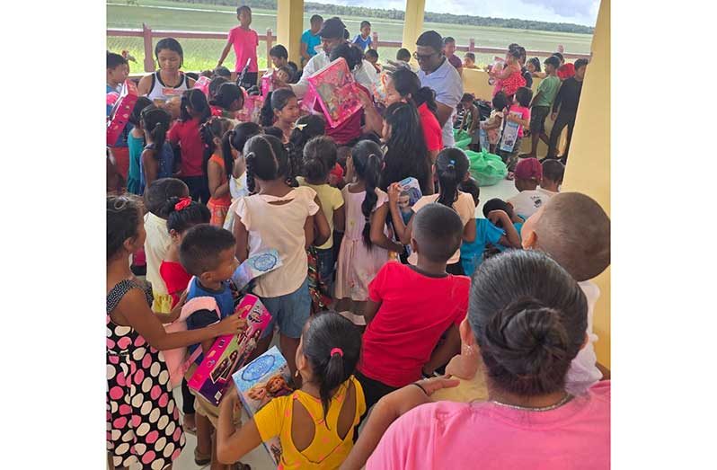 The children at Akawini receive toys